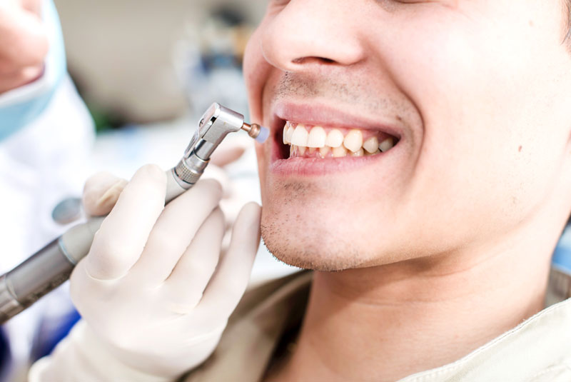 dental patient undergoing cleaning procedure